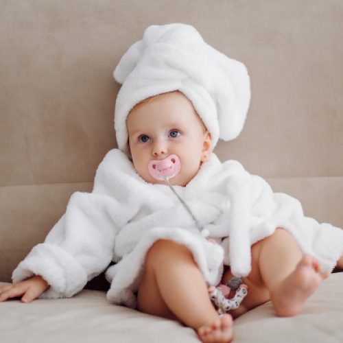 cute-baby-girl-white-bathrobe_1328-2539